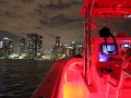 Sea Vee 34 lit up with Miami Skyline
