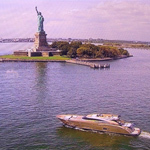 TLE-AB Yacht in front of Statue of Liberty